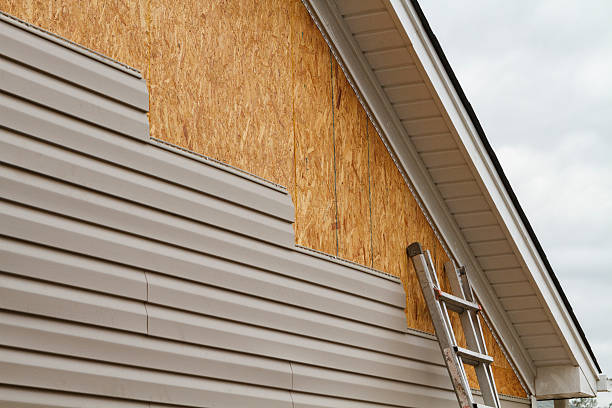 Professional Emergency Siding Repair technician working in Roanoke, TX